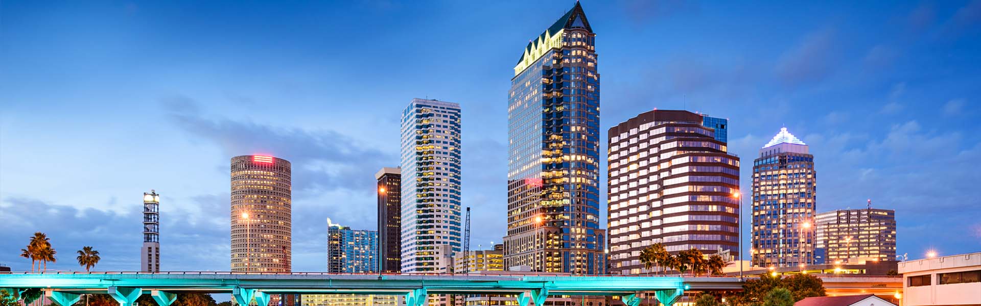 Neon color image of a band playing and people singing along